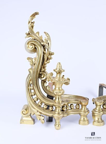 Pair of bronze andirons presenting a baluster-shaped...