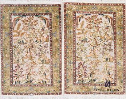 Pair of silk carpets decorated in its center...