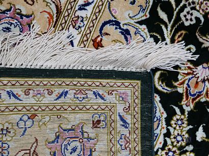 QUONE

Silk carpet decorated with a central...