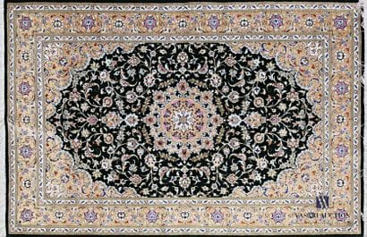 QUONE

Silk carpet decorated with a central...
