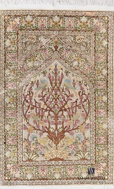 Small silk carpet decorated in the centre...