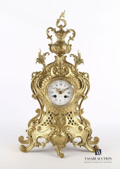 Varnished bronze clock, the round white enamelled...