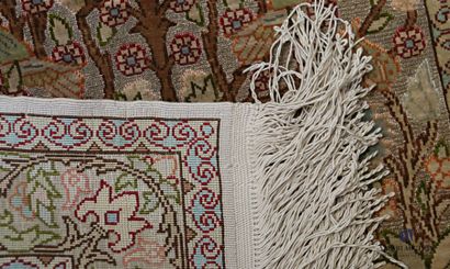Small silk carpet decorated in the centre...