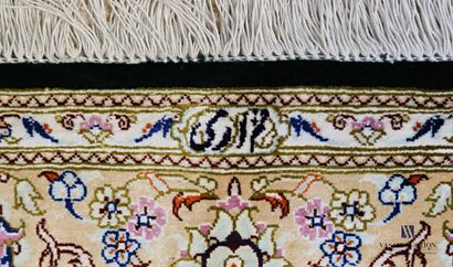 QUONE

Silk carpet decorated with a central...
