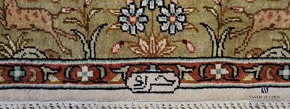 Pair of silk carpets decorated in its center...