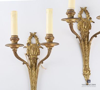 Pair of gilt bronze two-light sconces, the...