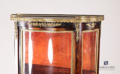 Natural wood and veneer showcase, it is topped...