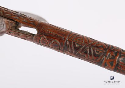 Carved and engraved wooden shaft with carved...