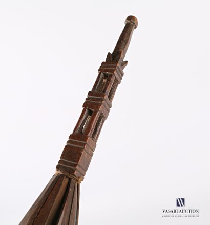Caged cattail with a wooden wheel with carved...
