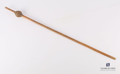 A wooden and woven wicker cattail with a...
