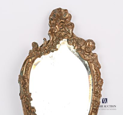 Face to hand in bronze, the bevelled mirror...