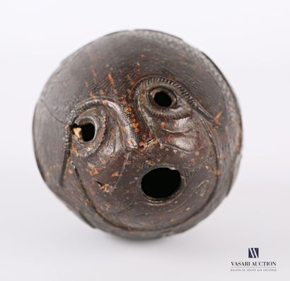 Wooden pendant forming a pod with a carved...