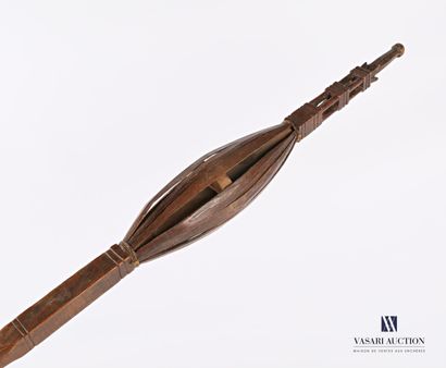 Caged cattail with a wooden wheel with carved...