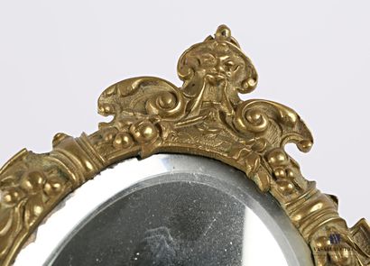Face to face in bronze, the bevelled oval...