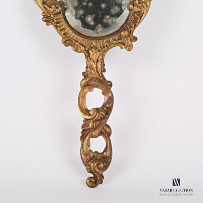 Face to hand in bronze, the bevelled mirror...