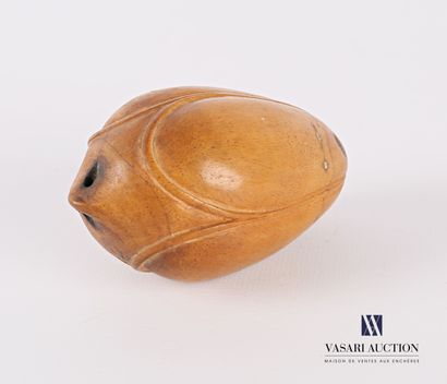 Wooden pendant in the shape of a pod.

(slight...