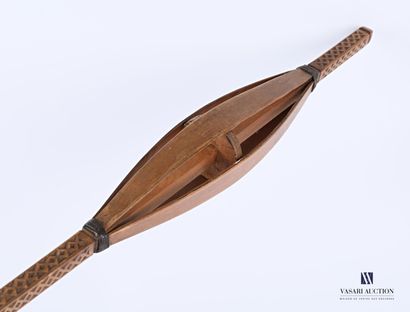Caged cattail with wooden wheel, head and...