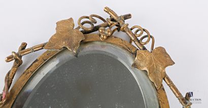Face to hand in bronze, the mirror with bevelled...