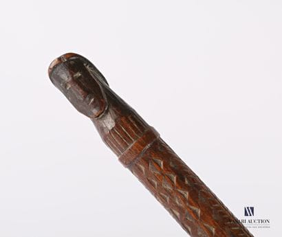 Carved and engraved wooden shaft with carved...