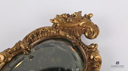 Face to hand in bronze, the bevelled mirror...