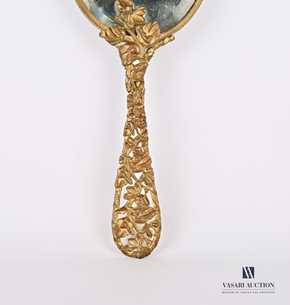 Facing a brass hand, the bevelled oval view...