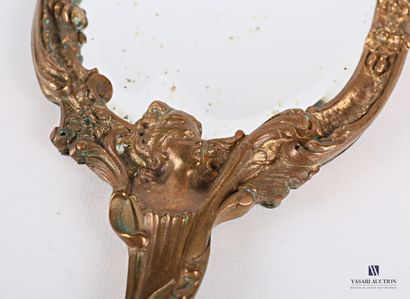 Face to hand in bronze, the bevelled mirror...