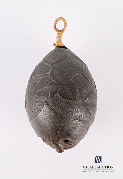 Wooden pendant forming a pod with a carved...