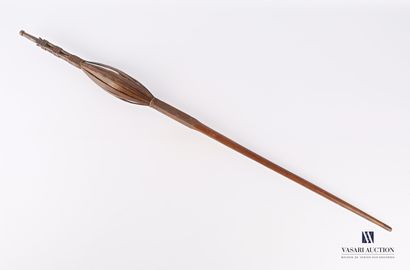 Caged cattail with a wooden wheel with carved...