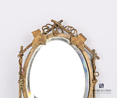 Face to hand in bronze, the mirror with bevelled...