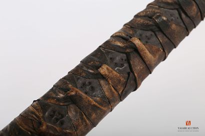 Katana, slightly curved sharpened blade of...