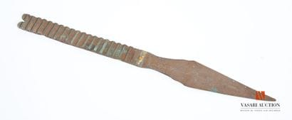 Carved metal point marked 