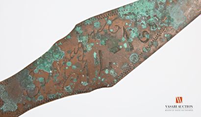 Carved metal point marked 