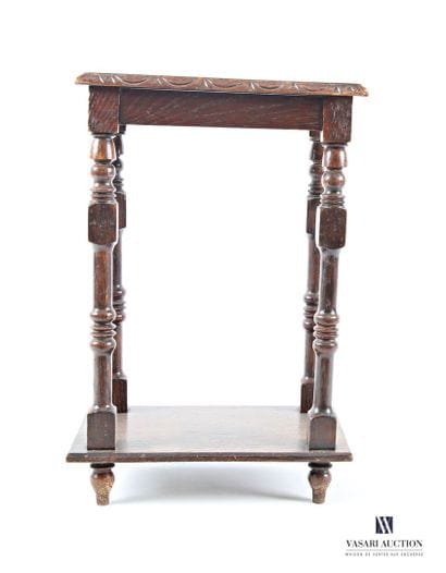 The rectangular top is carved with a flower...