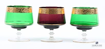 Suite of three colored glass bowls decorated...