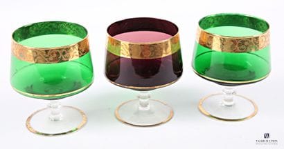 Suite of three colored glass bowls decorated...