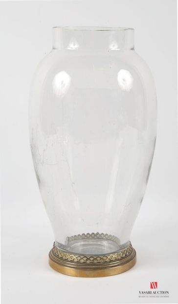 A large ovoid crystal vase, standing on a...