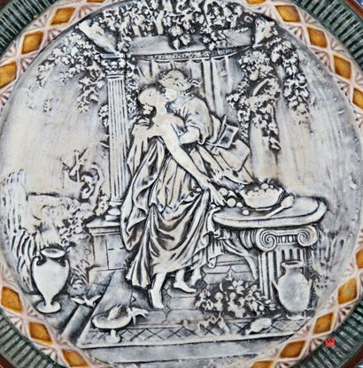Barbotine round dish decorated in the basin...
