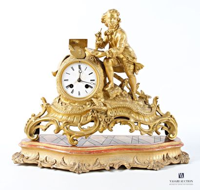Gilded regule clock, with white enameled...