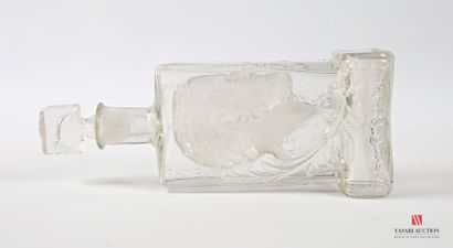 Glass bottle with molded decoration in the...
