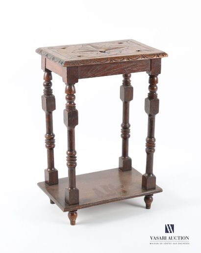 The rectangular top is carved with a flower...