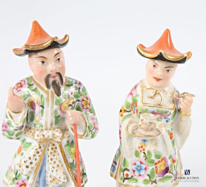 Asian porcelain couple adorned with flower-decorated...