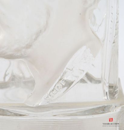 Glass bottle with molded decoration in the...