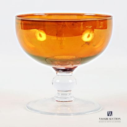 Round bowl in colored glass, standing on...