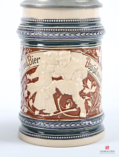 Two polychrome earthenware covered mugs,...