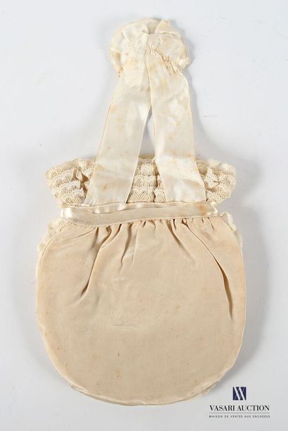 Embroidered fabric and lace purse decorated...