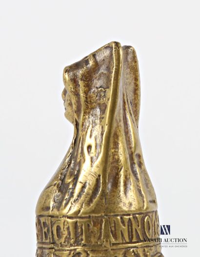 Bronze bell featuring a female bust, the...