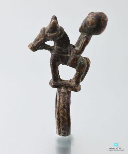 Copper alloy ring surmounted by a horseman...