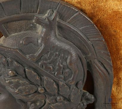 Regula plate with brown patina depicting...