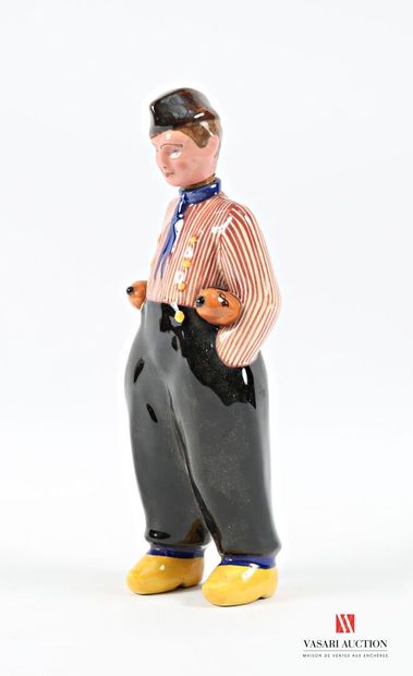 Ceramic bottle featuring a robed man carrying...