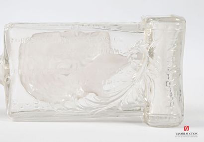 Glass bottle with molded decoration in the...